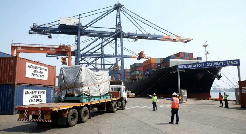 Covered machinery on a trailer at a container port