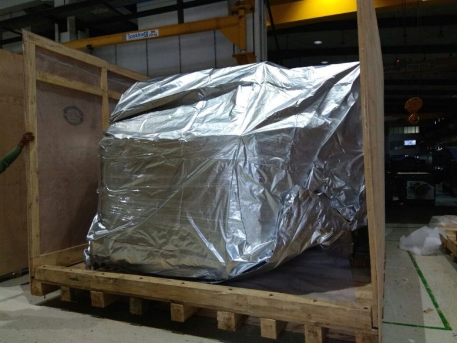 Machinery wrapped and secured inside an export crate