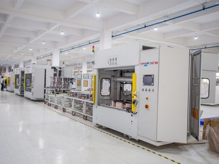 Production machines lined up in a new manufacturing hall